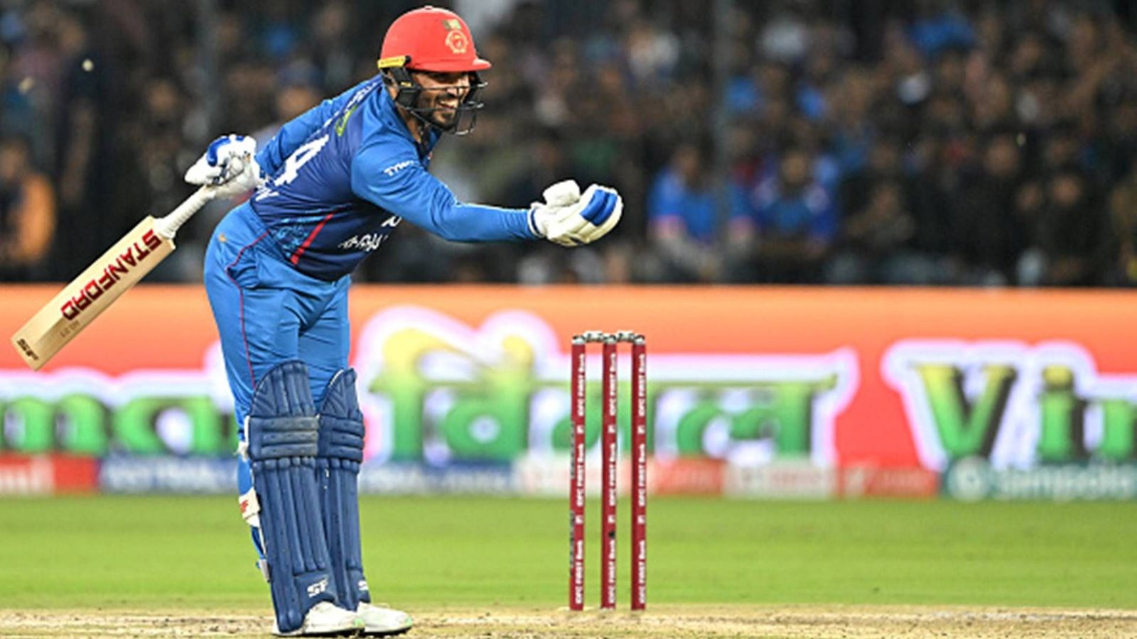 Gulbadin Naib becomes third Afghanistan cricketer to achieve this feat in T20Is against India with 35-ball 57 in Indore Gulbadin Naib celebrates his half-century against India in Indore (Getty Images)