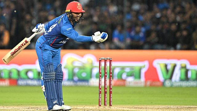 Gulbadin Naib becomes third Afghanistan cricketer to achieve this feat in T20Is against India with 35-ball 57 in Indore Gulbadin Naib celebrates his half-century against India in Indore (Getty Images)