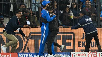 Virat Kohli's fan detained for breaching security and hugging him during Indore T20I against Afghanistan A fan hugs Virat Kohli while security rushes at Holkar Stadium (Getty Images)