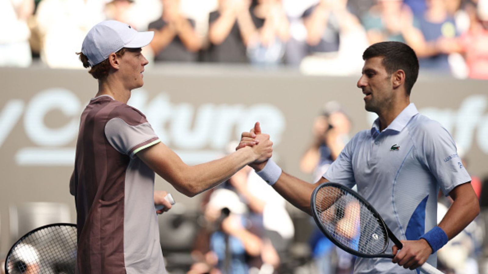 Novak Djokovic's quest for 25th Grand Slam title ends as 22-year-old Italian stuns World No.1 in Australian Open Jannik Sinner (L) and Novak Djokovic (R).
