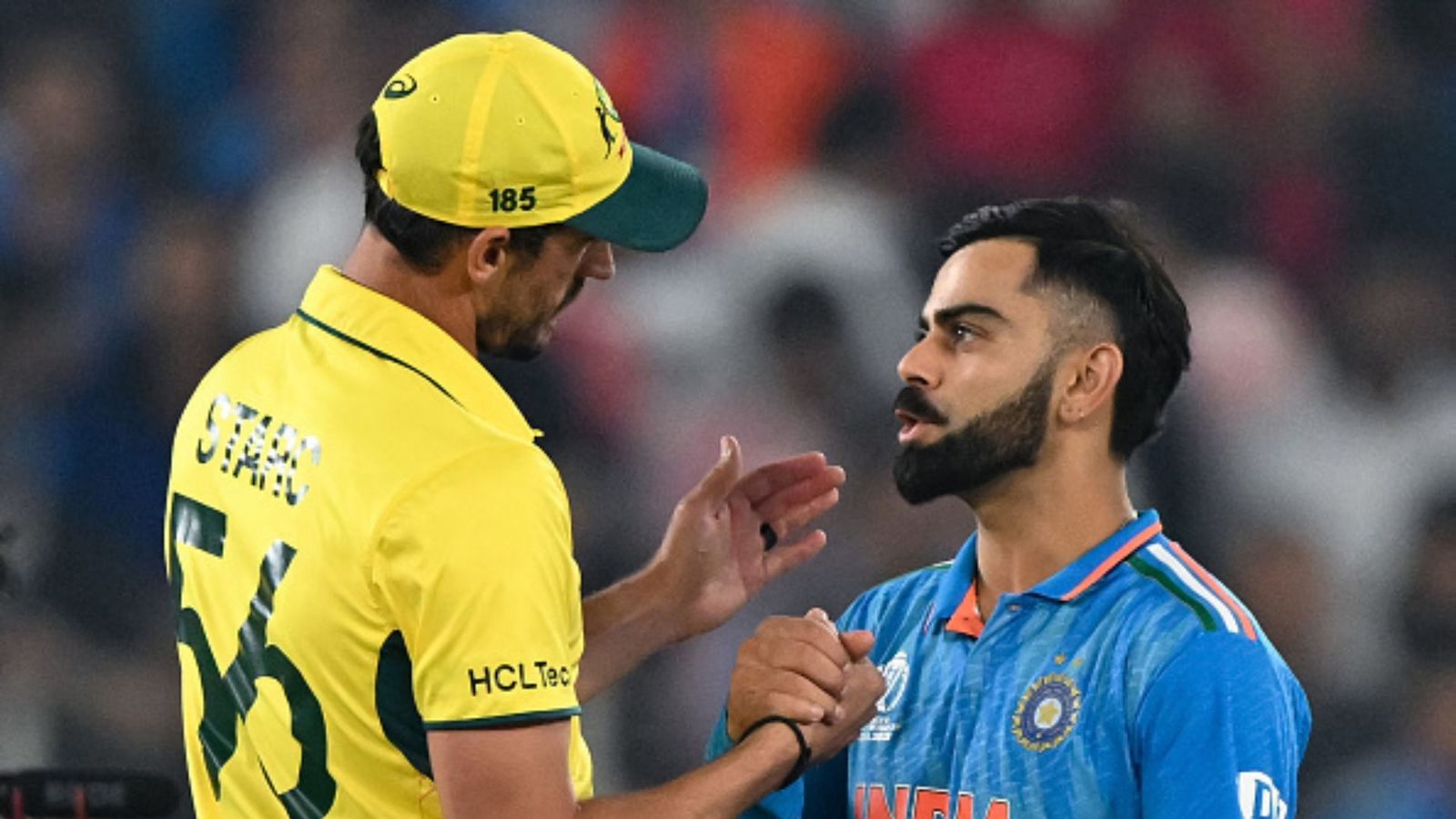 Mitchell Starc revisits stint with RCB in IPL, reveals Virat Kohli's traits on and off the field; watch video Mitchell Starc (L) and Virat Kohli (R).