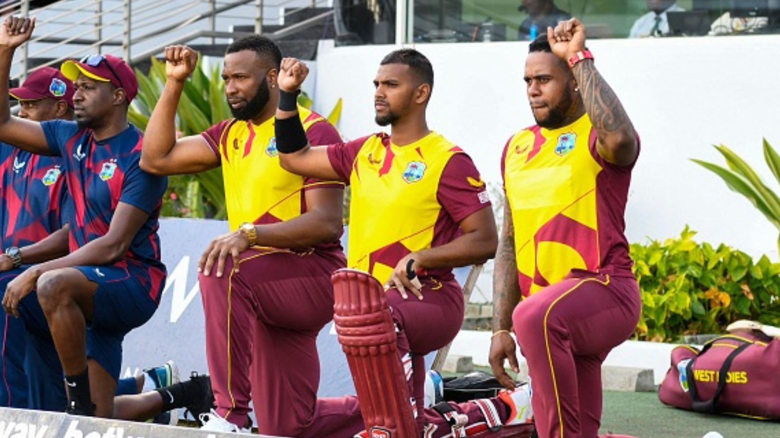 WI's star all-rounder robbed at gunpoint outside Paarl Royals' team hotel on sidelines of SA20 Kieron Pollard (2L), Nicholas Pooran (2R) and Fabian Allen (R) of West Indies kneel for Black Lives Matter in this file photo. (Getty)