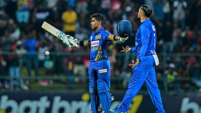 SL vs AFG: Pathum Nissanka's century leads Sri Lanka to series whitewash against Afghanistan with 7-wicket win in 3rd ODI Sri Lanka's Pathum Nissanka (L) celebrates after scoring his century during the third ODI against Afghanistan in Kandy on February 14. (Getty)