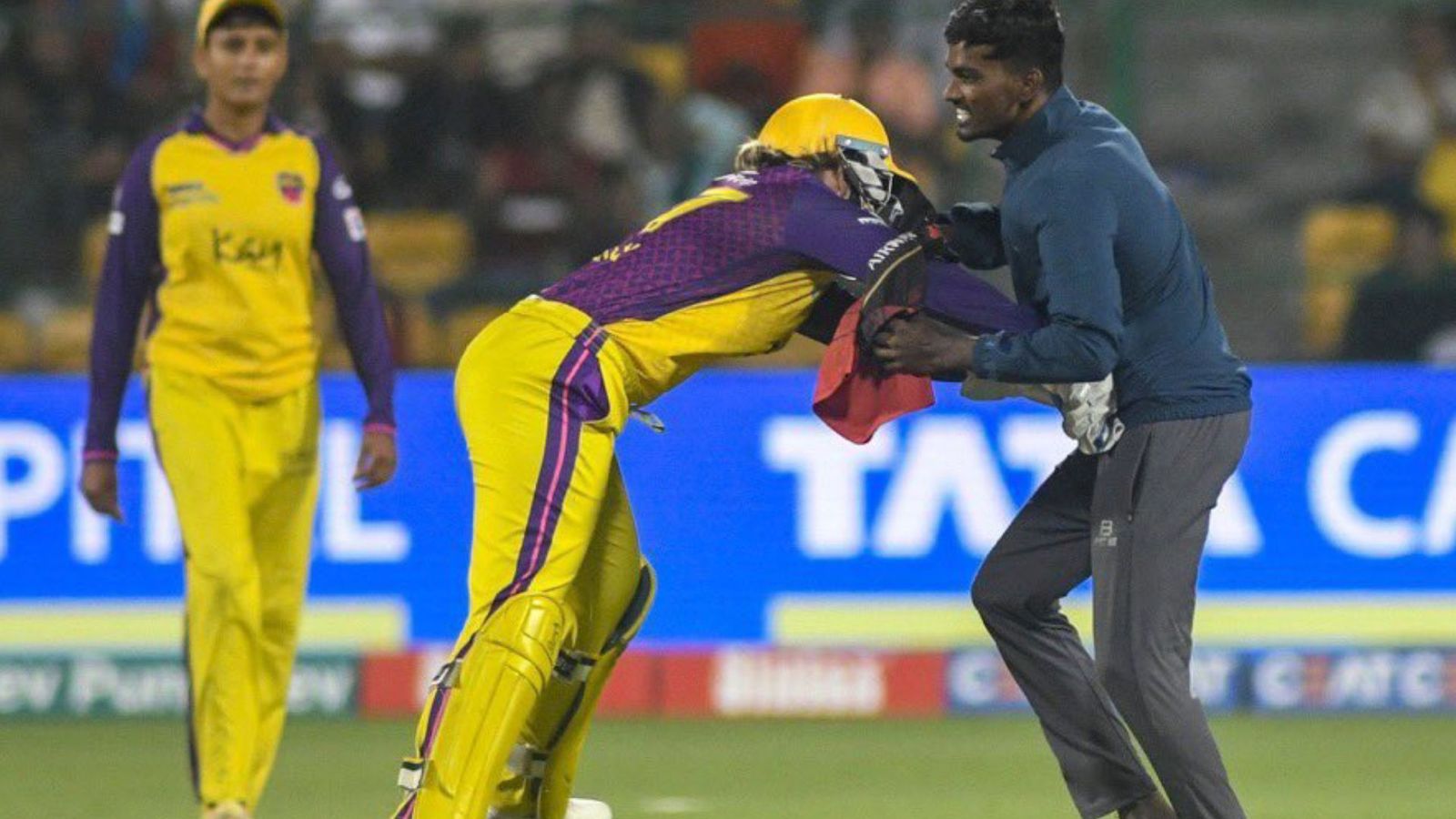 WPL 2024: Alyssa Healy channels her inner wrestler to tackle pitch invader at Chinnaswamy Stadium; pictures go viral Alyssa Healy tackling a pitch invader.