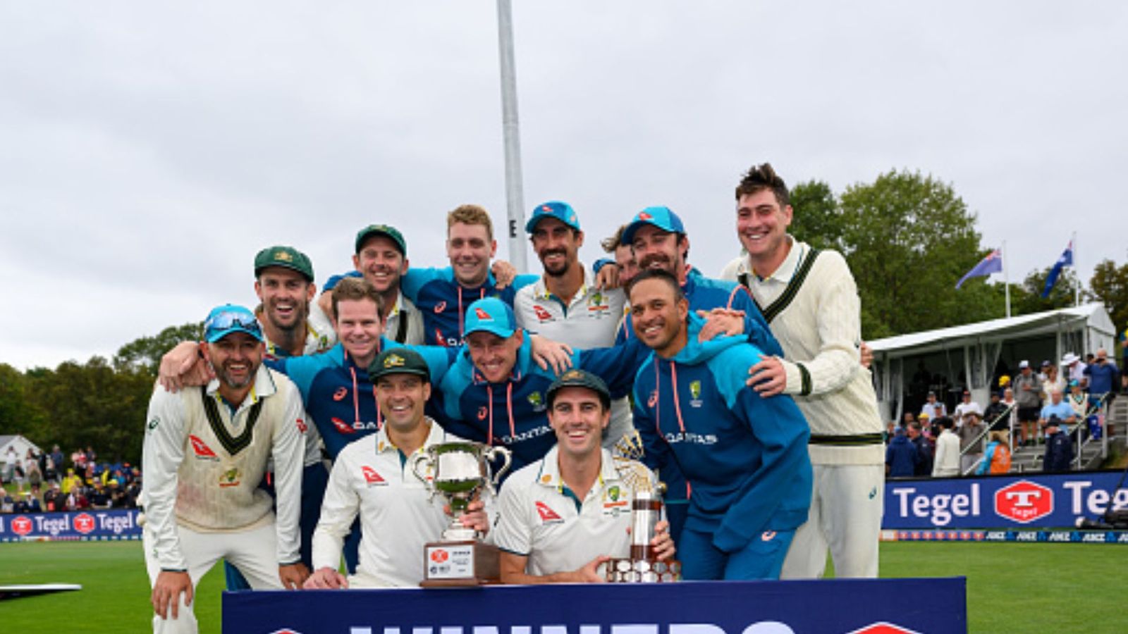 WTC 2023-25 Standings: Big change in World Test Championship points table after Australia's win over New Zealand; check India's position Australian players posing with the trophy.