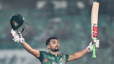 Najmul Hossain Shanto's historic century steers Bangladesh to emphatic 6-wicket victory over Sri Lanka in 1st ODI Bangladesh's captain Najmul Hossain Shanto celebrates after scoring a century during the first ODI against Sri Lanka on March 13. (Getty)