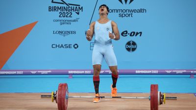 India's CWG gold medallist thrown out of national camp for unauthorised entry into women's hostel at night, Paris Olympics dream shattered India's Achinta Sheuli reacts after competing during the Men's Weightlifting 73kg Final at Birmingham 2022 Commonwealth Games at NEC Arena on July 31, 2022 on the Birmingham, England. (Getty)