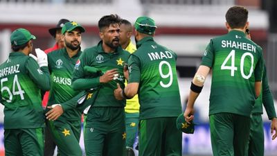 Pakistan star drops massive hint at retirement reversal ahead of T20 World Cup, says 'Shaheen Afridi called me after...' File Photo: Pakistan's Imad Wasim (2R) shakes hands with Mohammad Amir (C) as they celebrate with teammates after victory in the 2019 Cricket World Cup group stage match against South Africa on June 23, 2019. (Getty)