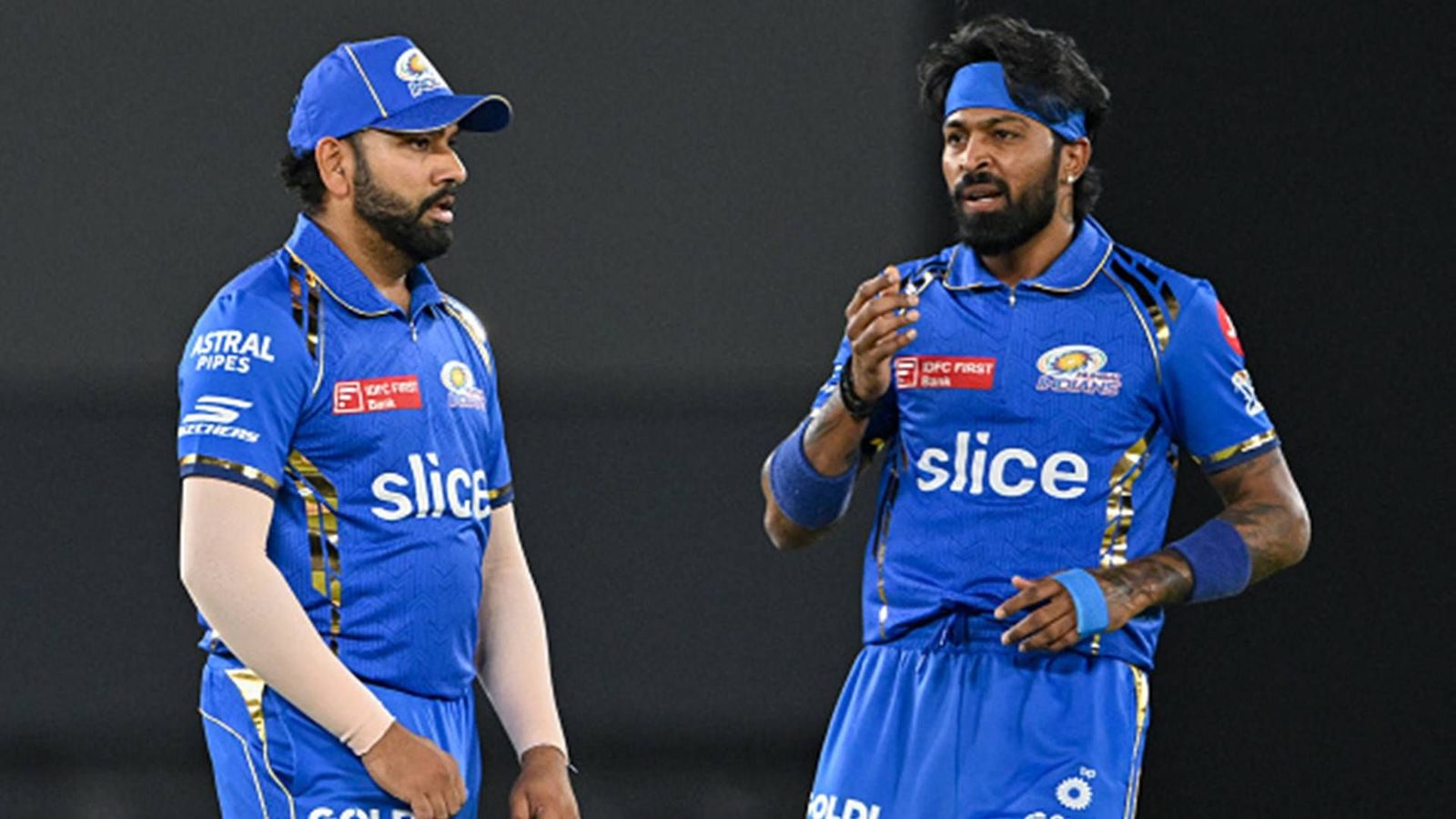 Hardik Pandya booed by Ahmedabad crowd, chants of 'Rohit-Rohit' echo in stadium during GT vs MI clash; watch video Rohit Sharma and Hardik Pandya during Mumbai Indians' clash against Gujarat Titans (Getty Images)