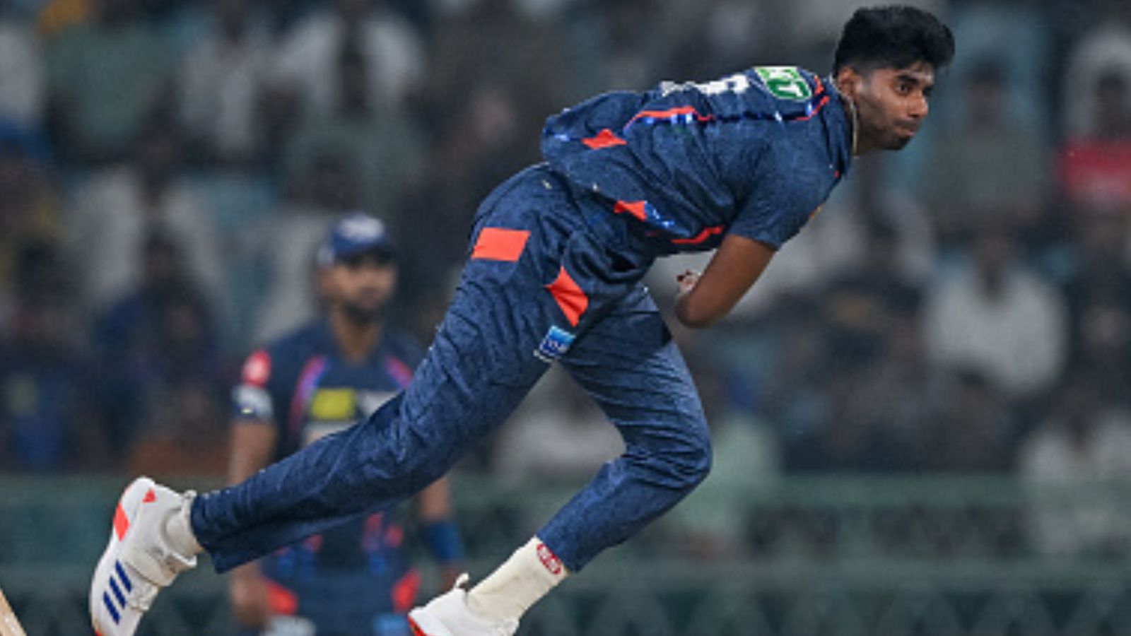 Who is Mayank Yadav, who wreaked havoc with his tearaway speed to demolish PBKS and catapult LSG to first win in IPL 2024? LSG's bowling sensation Mayank Yadav in action in this frame. (Getty)