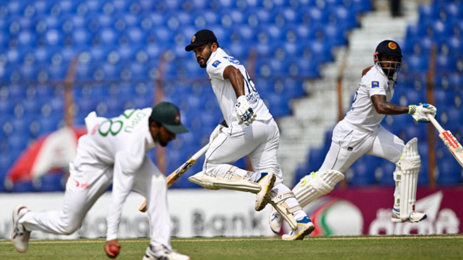 BAN vs SL: Sri Lanka script monumental world record by clocking 531 runs on the board against Bangladesh in 2nd Test Sri Lanka's Kusal Mendis (R) and Dimuth Karunaratne (C) run between the wickets during the first day of the 2nd Test against Bangladesh in Chittagong on March 30. (Getty)