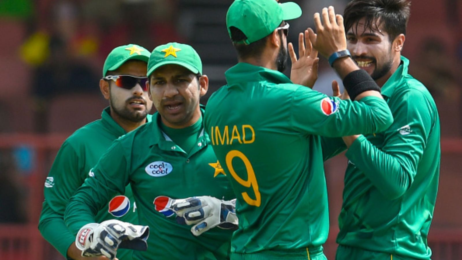 ‘Makes no sense’: Former Pakistan cricketers slam Babar Azam for excluding star all-rounder from playing XI Mohammad Amir (R) of Pakistan celebrates with Imad Wasim (2R), Sarfraz Ahmed (2L) and Babar Azam (L). (File Photo: Getty)