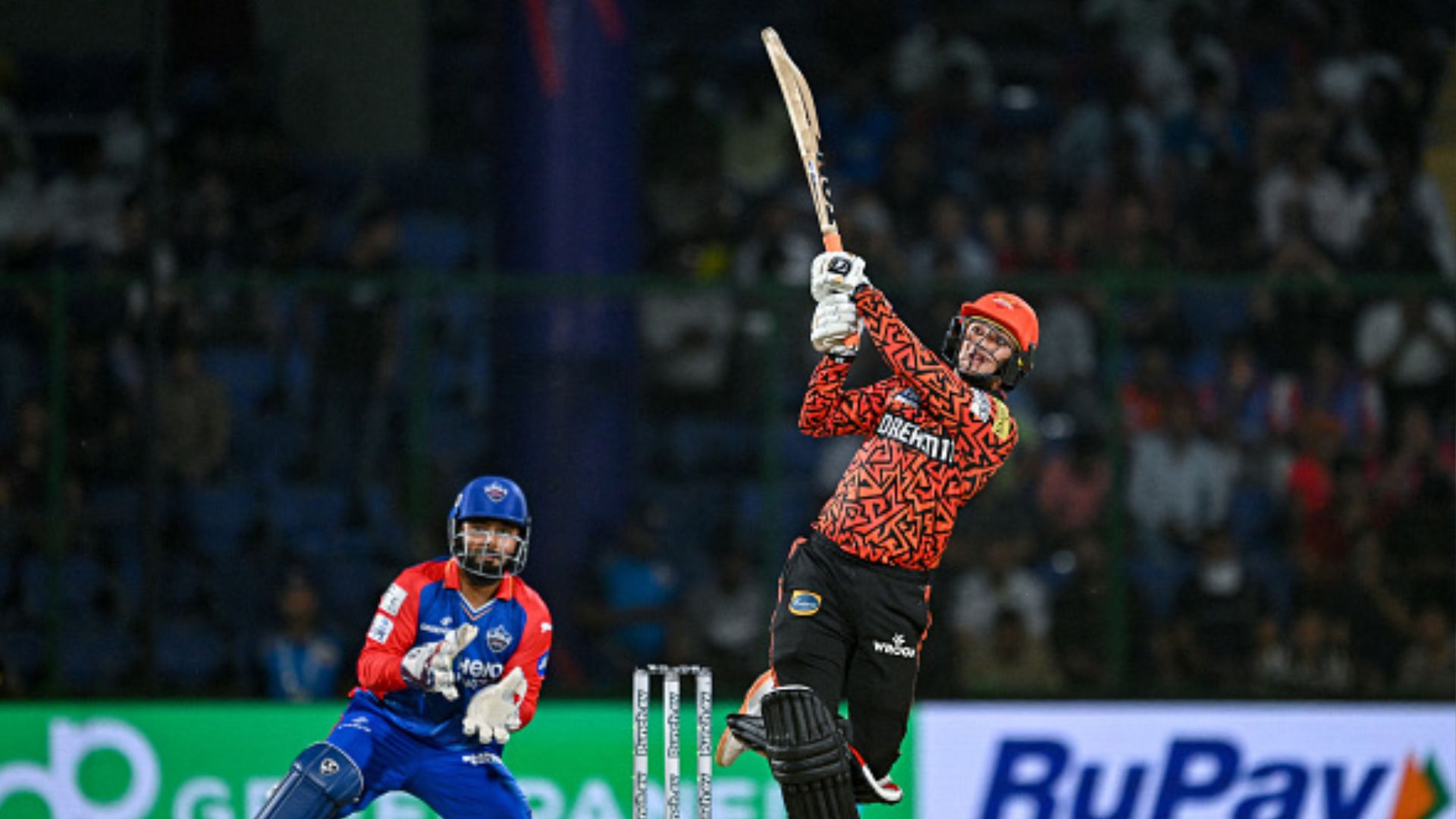 'Other teams also could not control it': Coach comes to Rishabh Pant's brigade's rescue after SRH batters make mincemeat of DC bowlers Sunrisers Hyderabad's Abhishek Sharma plays a shot as Delhi Capitals' captain Rishabh Pant (L) watches during their IPL 2024 clash on April 20. (Getty)