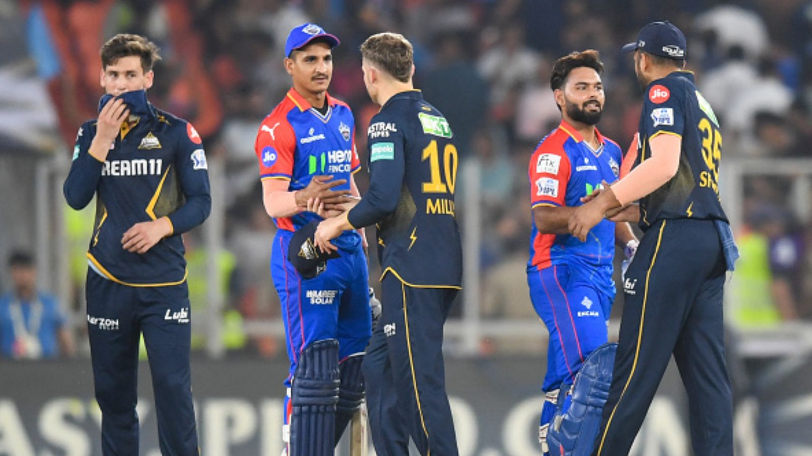 Delhi Capitals' player punished for aggressive celebration during IPL 2024 clash against Gujarat Titans Delhi Capitals players shake hands with Gujarat Titans players after their IPL 2024 clash. (Getty)