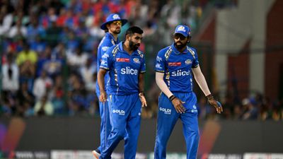 EXPLAINED: How Mumbai Indians can still qualify for IPL 2024's playoffs despite defeat against Delhi Capitals? Know all scenarios Mumbai Indians' Jasprit Bumrah (C) speaks captain Hardik Pandya (R) after dismissal of Delhi Capitals' captain Rishabh Pant (not pictured) during their IPL 2024 clash. (Getty)