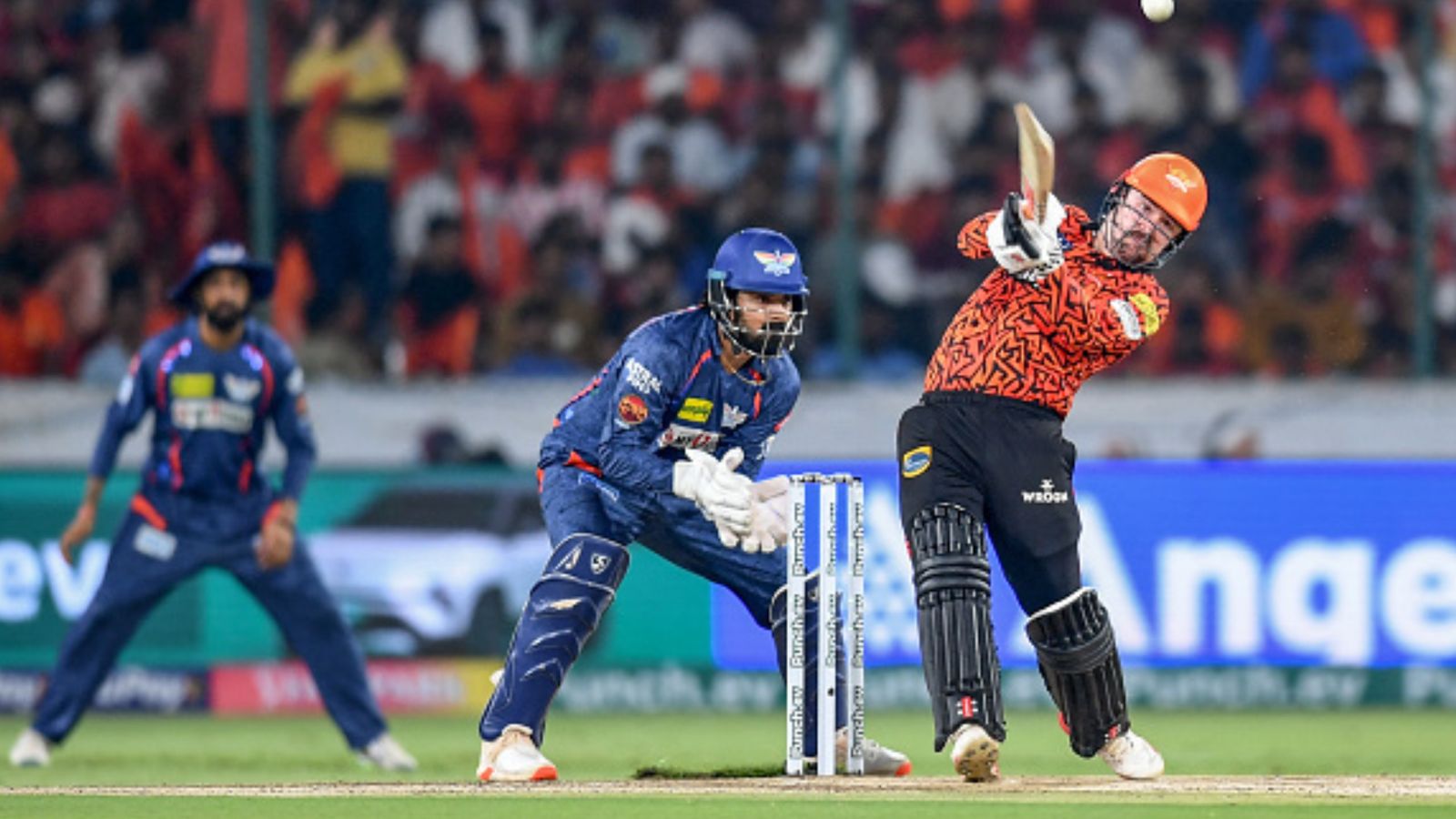 IPL 2024 Orange Cap: Travis Head dazzles into top 3 after cracking knock vs LSG, hot on heels with Ruturaj Gaikwad, Virat Kohli Sunrisers Hyderabad's Travis Head (R) plays a shot as Lucknow Super Giants' wicketkeeper and captain KL Rahul (C) watches during their IPL 2024 clash on May 8. (Getty)