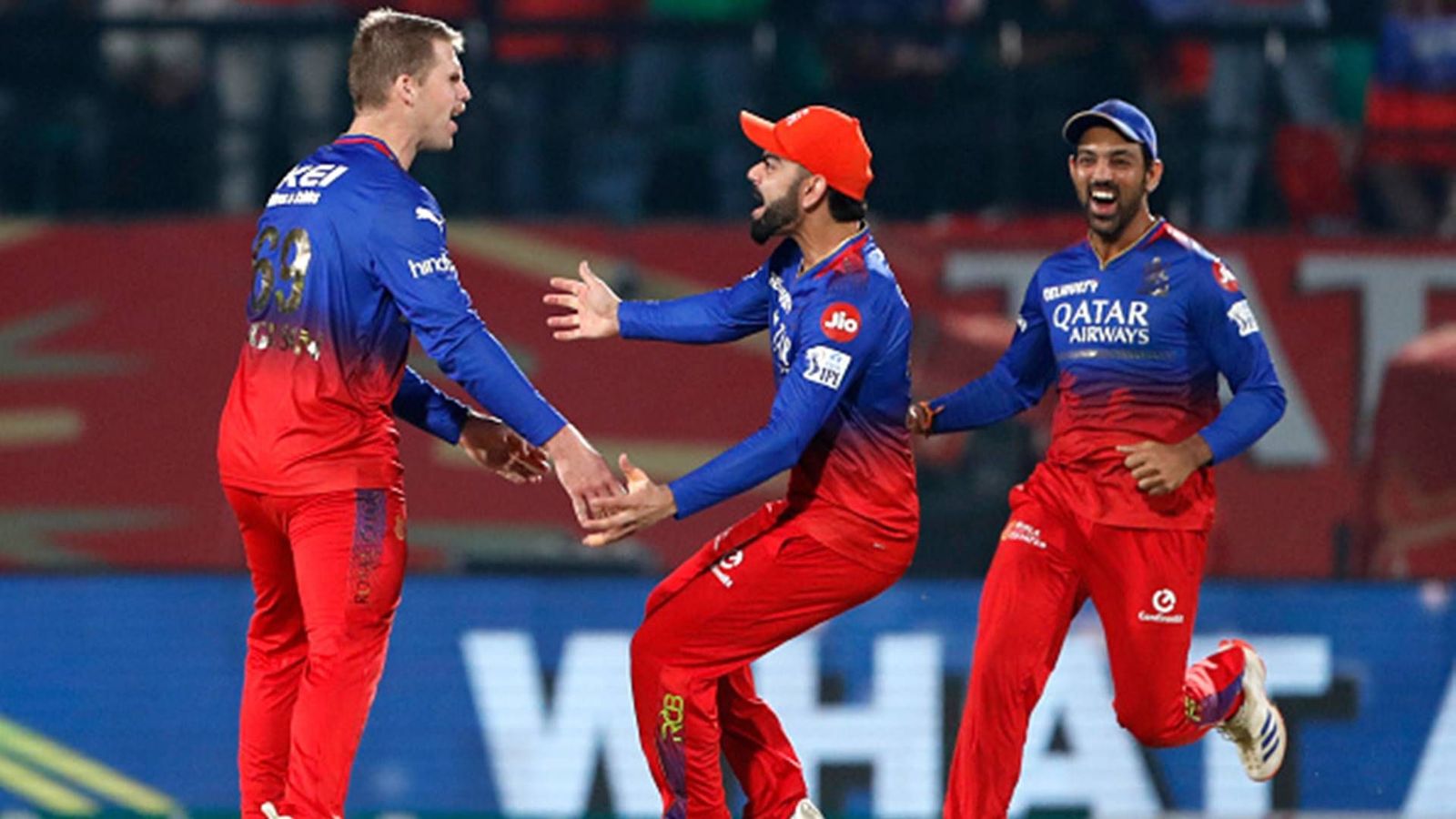 Virat Kohli's mighty 92, bowlers' clinical display help RCB beat PBKS by 60 runs to keep playoff hopes alive Lockie Ferguson celebrates a wicket with Virat Kohli and Swapnil Singh (Getty Images)