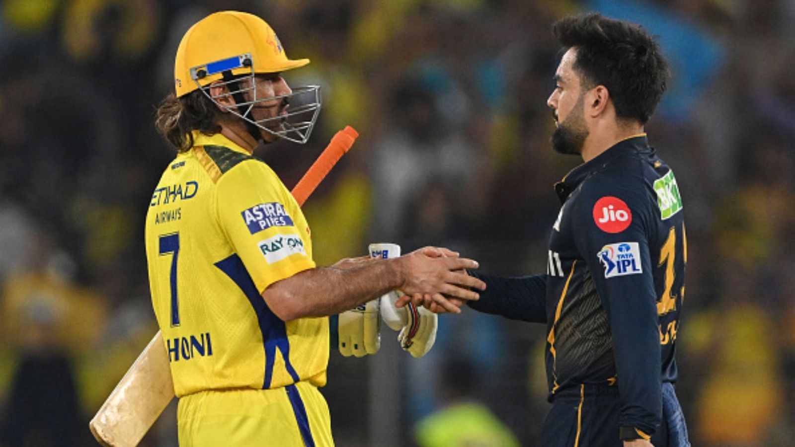 'He comes to play it's a different feeling': Rashid Khan praises MS Dhoni's aura after clash in Ahmedabad MS Dhoni and Rashid Khan in frame (Getty)
