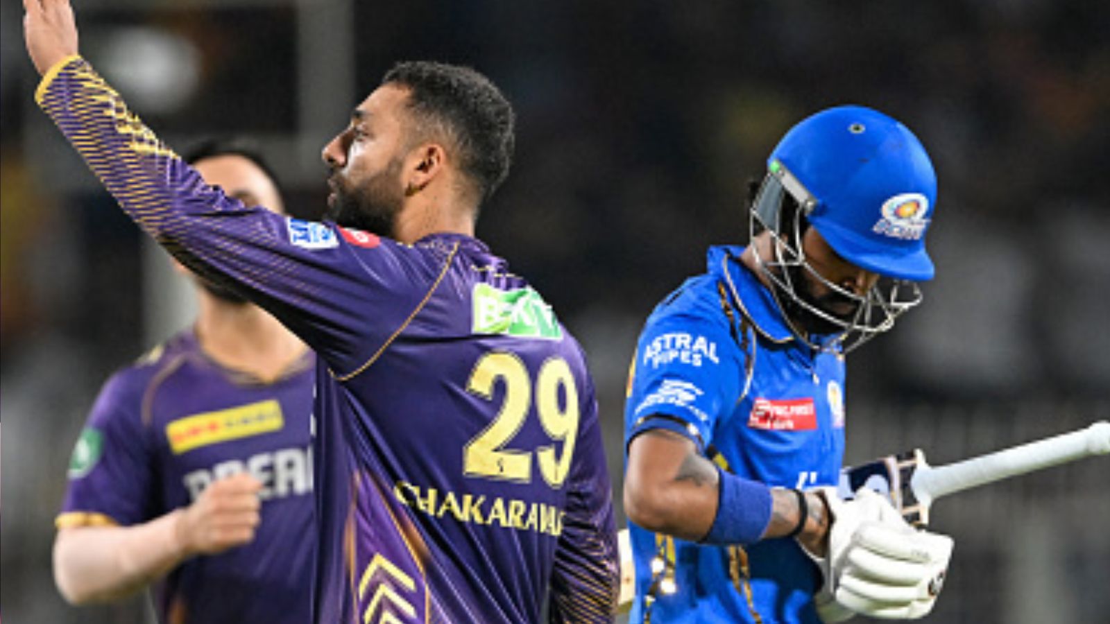 IPL 2024: KKR become first team to qualify for playoffs with convincing win over Mumbai Indians in rain-curtailed match KKR's Varun Chakaravarthy (left) celebrates after dismissing MI skipper Hardik Pandya during their IPL 2024 clash on May 11. (Getty)