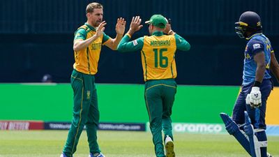 Anrich Nortje's record-breaking four-fer helps South Africa bundle out Sri Lanka for 77, start T20 World Cup 2024 campaign with six-wicket win Anrich Nortje celebrates a wicket with teammate Keshav Maharaj (Getty Images)