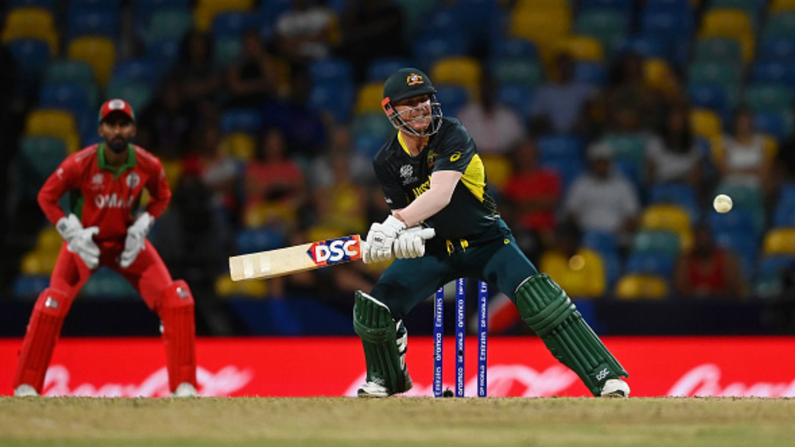 David Warner scripts history, breaks Chris Gayle's World Record with impressive half-century against Oman in Australia's win Australia's David Warner in action during the T20 World Cup match against Oman at Kensington Oval on June 5. (Getty)