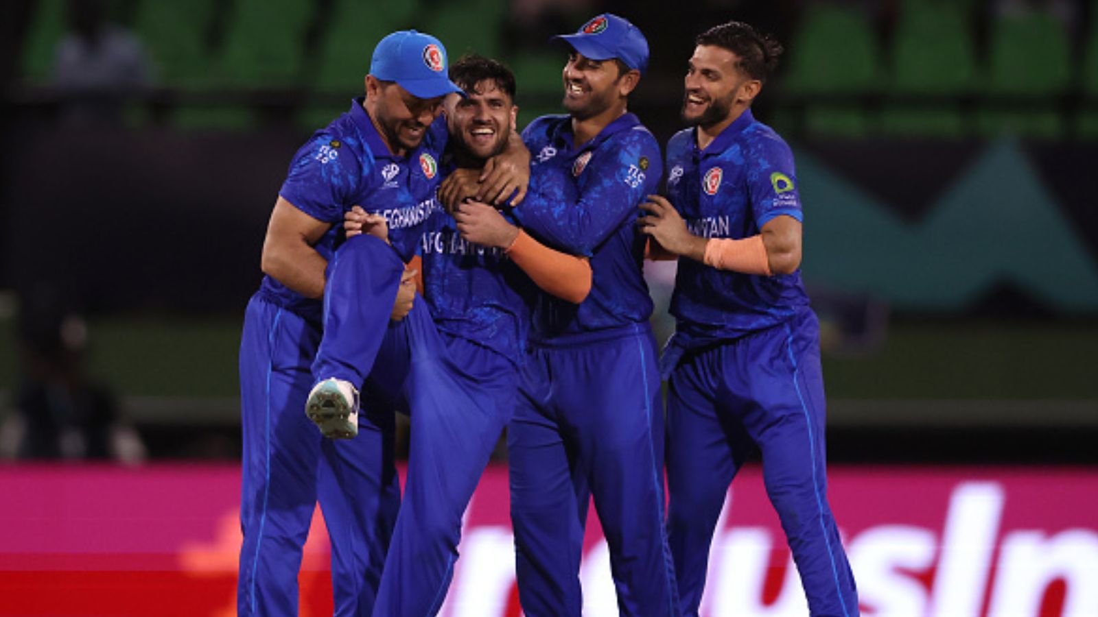 Fazalhaq Farooqi becomes 1st bowler in history of T20 World Cup to bag this mighty feat with stunning spell in Afghanistan's upset win over NZ Afghanistan's Fazalhaq Farooqi celebrates with teammates after dismissing Matt Henry of New Zealand during their T20 World Cup 2024 match on June 8. (Getty)