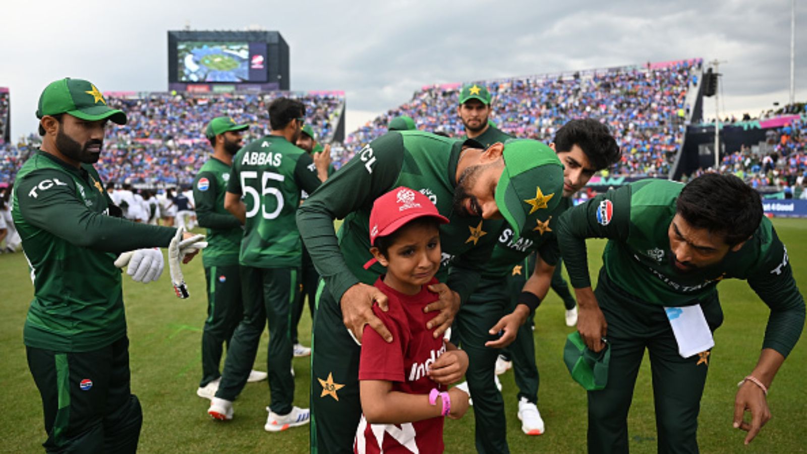 Pakistan star accused of deliberately wasting balls to make chase tough in T20 World Cup match against India Pakistan's Babar Azam and Mohammad Amir help a young mascot during the T20 World Cup 2024 against India. (Getty)