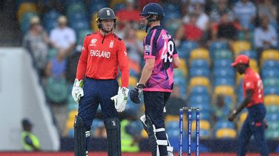 Explained: How Scotland's big win over Oman has put defending champions England's Super 8 qualification chances in jeopardy England captain Jos Buttler and Michael Jones (Getty Images)