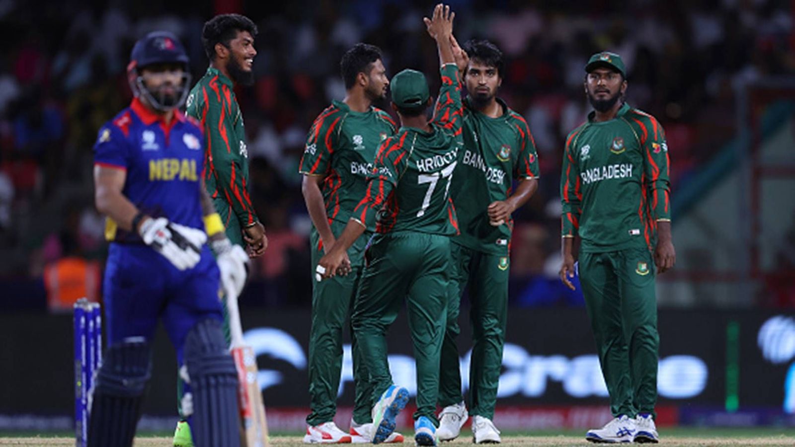 Tanzim Hasan Sakib’s sensational four-fer helps Bangladesh defend lowest total to beat Nepal by 21 runs and advance to Super 8 stage Tanzim Hasan Sakib celebrates Nepal opener's wicket with teammates (Getty Images)