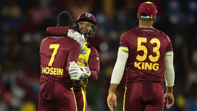 Nicholas Pooran stars with 98-run knock as West Indies beat Afghanistan by 104 runs to continue unbeaten run on a record-breaking night Nicholas Pooran congratulates Akeal Hosein for a wicket against Afghanistan (Getty Images)