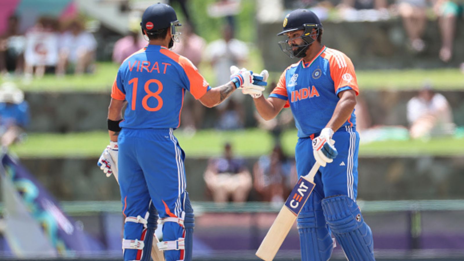'Selectors will have to...': Virender Sehwag issues grave warning to Rohit Sharma, Virat Kohli amidst their dismal T20 World Cup outing India's Rohit Sharma (R) and Virat Kohli touch gloves during the T20 World Cup 2024 match against Bangladesh on June 22. (Getty)