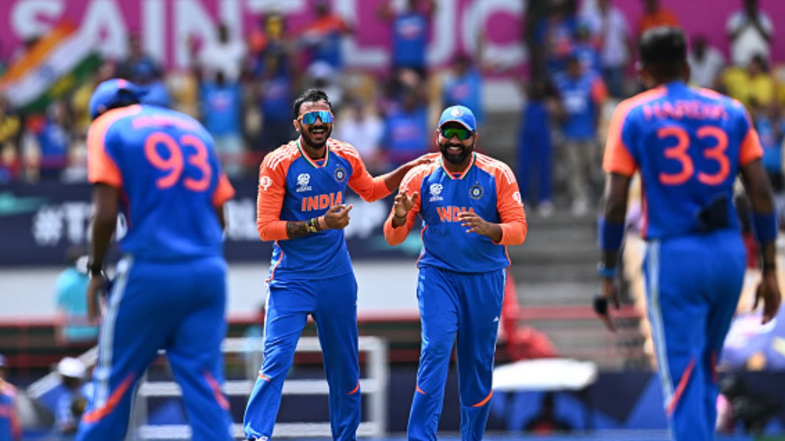 India officially qualify for the T20 World Cup semifinal irrespective of the result in Super 8 clash vs Australia India's Axar Patel (2nd L) and India's captain Rohit Sharma (2nd R) celebrate after dismissing Australia's Marcus Stoinis during their T20 World Cup match on June 24, 2024. (Getty)