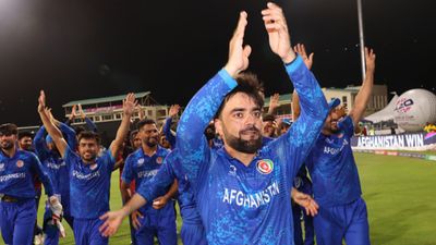 ICC punishes Rashid Khan ahead of Afghanistan vs South Africa T20 World Cup semifinal clash, will he be banned? Afghanistan skipper Rashid Khan acknowledges the fans after the team's victory against Bangladesh to advance for Semi Finals in the T20 World Cup. (Getty)
