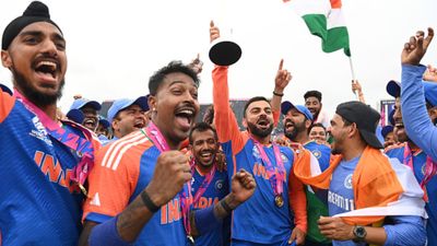 Big News: BCCI secretary Jay Shah announces massive prize money for T20 World Cup 2024 champions Team India Virat Kohli holds up the trophy with teammates including Rohit Sharma after India won the T20 World Cup 2024 trophy on June 29. (Getty)