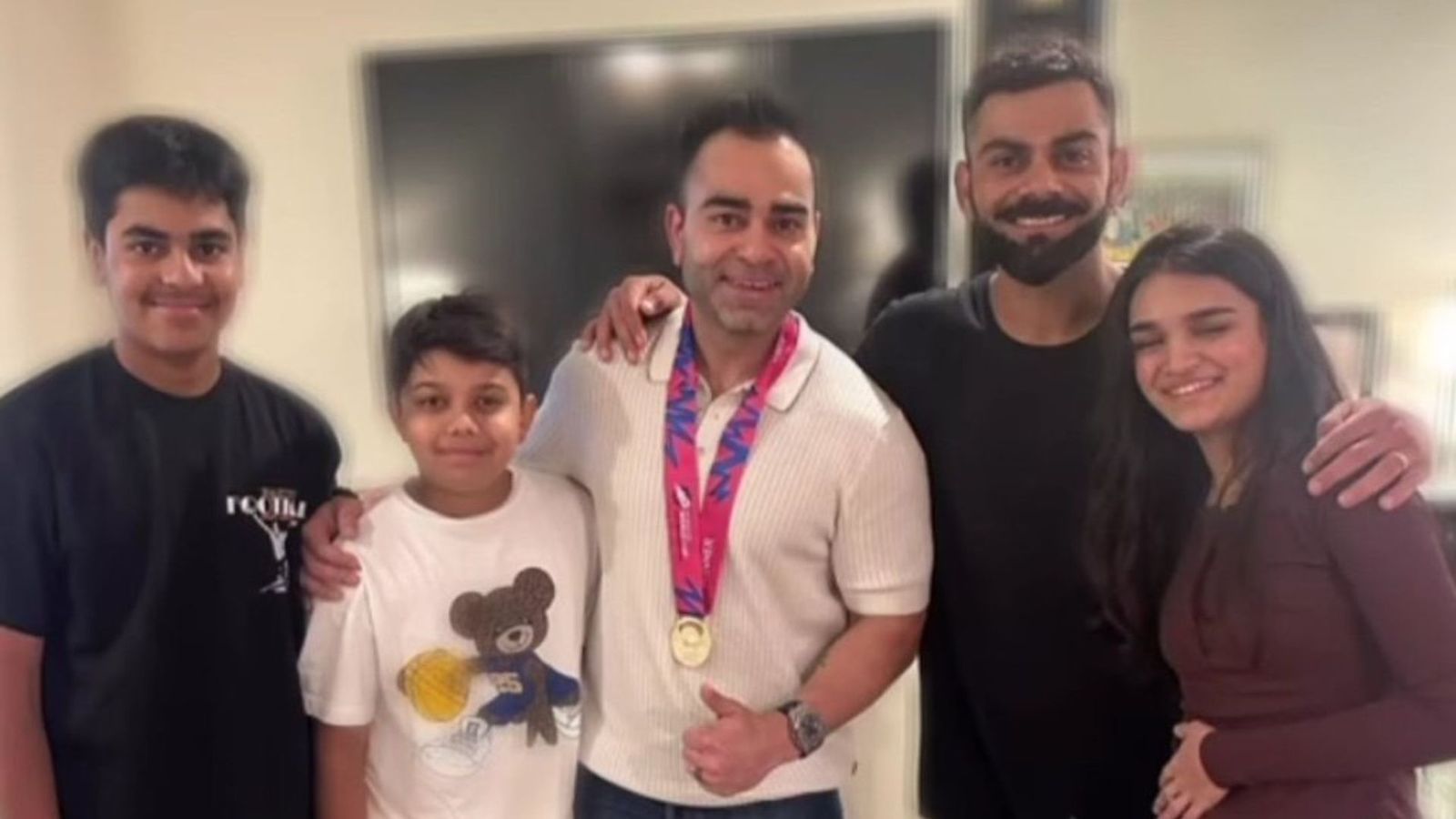Kohli's family come to meet champion batter in Delhi, Virat makes them wear T20 World Cup gold medal Kohli's family come to meet champion batter in Delhi, Virat makes them wear T20 World Cup gold medal