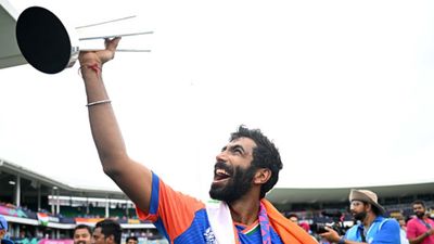 Jasprit Bumrah's big statement on retirement during Team India felicitation ceremony at Wankhede, says 'my retirement is...' India's Jasprit Bumrah celebrates with the T20 World Cup 2024 trophy in this frame. (Getty)