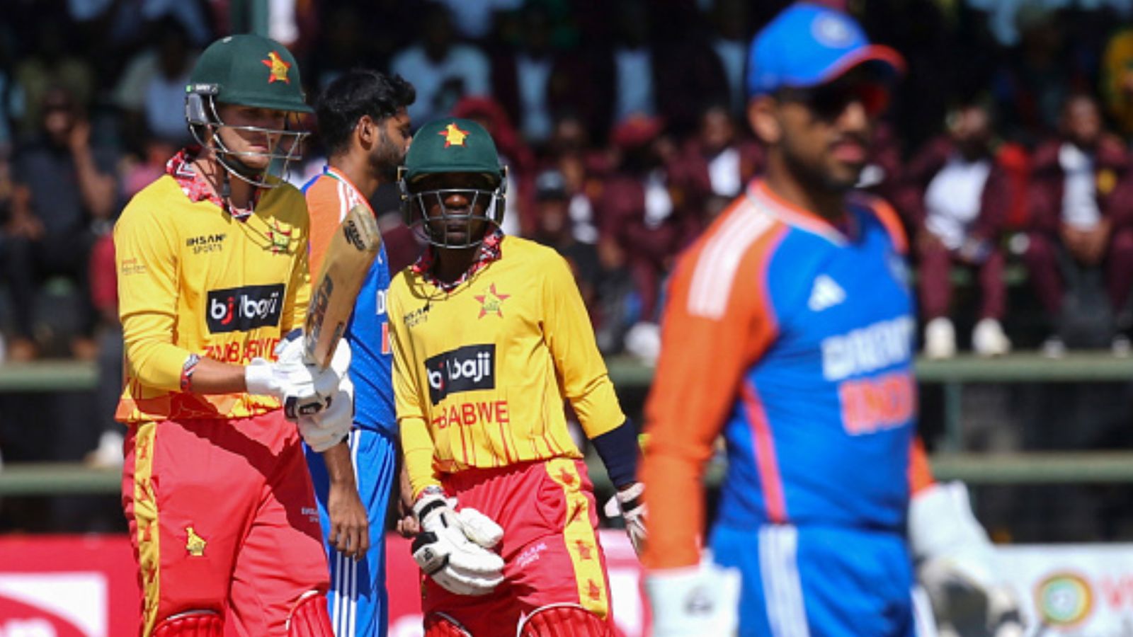 Shubman Gill's India suffer shocking defeat against Zimbabwe in 115-run chase in 1st T20I a week after becoming T20 World Cup champions Zimbabwe's Brian Bennett (L) and Wessly Madhevere (C) talk between overs during the first T20I against India at Harare Sports Club in Harare on July 6, 2024. (Getty)