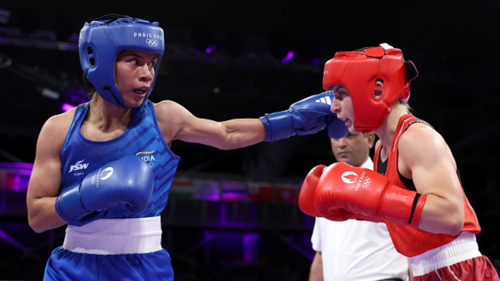 Paris Olympics: Nikhat Zareen guns down Germany’s Maxi Carina Kloetzer despite point deduction to roll into round of 16 India's Zareen Nikhat punches Maxi Carina Kloetzer of Team Germany during the Women's 50kg preliminary round match at the Olympic Games Paris 2024 on July 28. (Getty)