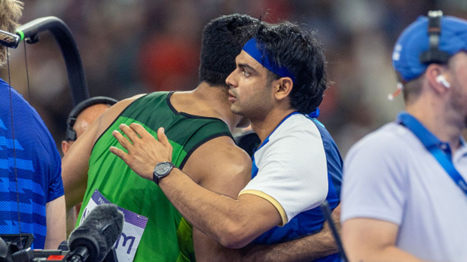 'Neeraj Chopra is like my son, prayed for him': Arshad Nadeem's mother's heart-winning comment on Indian javelin hero after Paris Olympics glory Pakistan's Arshad Nadeem (left) is congratulated on his gold medal and Olympic record performance in the Men's Javelin Throw Final by silver medal winner Neeraj Chopra of India at Paris Olympics. (Getty)