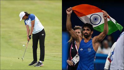 Paris Olympics 2024, Day 14 round-up: Aman Sehrawat claims record-breaking bronze medal, relay teams crash out Aditi Ashok in action; Aman Sehrawat with the Indian flag after winning bronze medal (Getty Images)