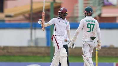 West Indies, South Africa settle for a draw in rain-hit 1st Test; Alick Athanaze's 92-run knock stands out despite Keshav Maharaj's four-fer Alick Athanaze raises his bat after getting to his half-century on Day 5 of first Test against South Africa (Getty Images)