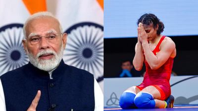 PM Modi lavishes praise on Vinesh Phogat, says 'She is first Indian to reach wrestling finals. It is a moment of great pride' India's Prime Minister Narendra Modi (left) and ace wrestler Vinesh Phogat in this frame. (Getty)