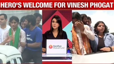 Vinesh Phogat's tearful arrival in India moves a nation SportsTak