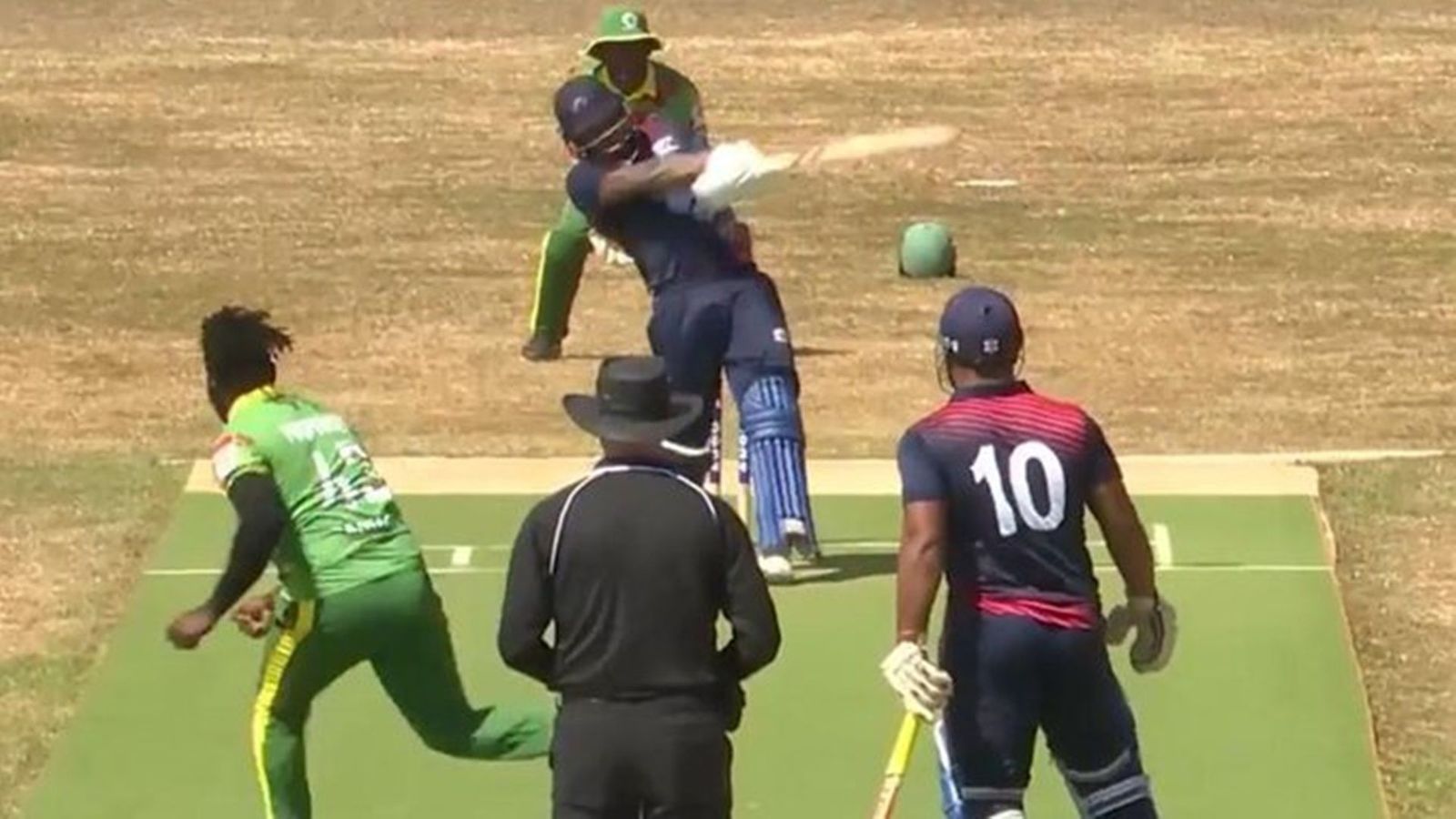 Batter from 77th ranked T20I side smashes 39 runs in an over to break Yuvraj Singh's record; watch video Darius Visser hits a six in the 39-run over (Screengrab: ICC)