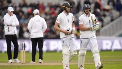 ENG vs SL, 1st Test: Jamie Smith's unbeaten 72 guides England to 23-run lead over Sri Lanka, end rain-hit Day 2 at 259/6 England's Gus Atkinson (left) and Jamie Smith walk off as bad light stops play during Day 2 of the first Test against Sri Lanka on August 22. (Getty)