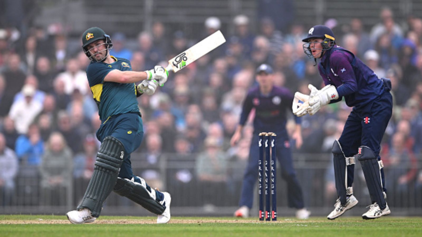 SCO vs AUS: England-born Aussie star scripts history, breaks Glenn Maxwell's record of fastest T20I century for Australia Australia batter Josh Inglis (left) hits out watched by wicketkeeper Charlie Tear during the 2nd Men's T20 between Scotland and Australia at The Grange Club on September 06, 2024 in Edinburgh, Scotland. (Getty)