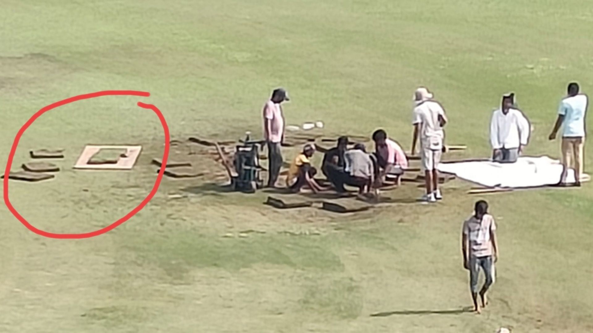 Chaos in Greater Noida! Ground staff digs up wet patch, covers rented from tent house as wait for historic AFG vs NZ Test continues Groundstaff dig up the wet patch in the stadium (Photo Courtesy: Siddharth Viswanathan)