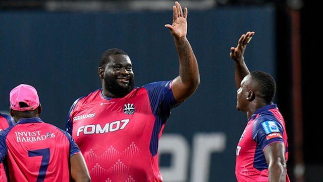 CPL 2024: Heaviest man to play Test cricket, Rahkeem Cornwall bags 5 wickets for 16 runs to lead Barbados Royals to flawless 9-wicket victory Rahkeem Cornwall celebrates a wicket with captain Rovman Powell (Getty Images)