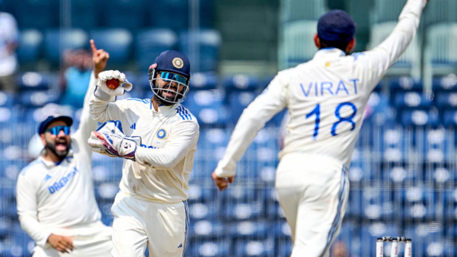 'Charo taraf aap hi dikh rahe ho': Rishabh Pant's hilarious remarks caught in stump mic during IND vs BAN 1st Test Rishabh Pant celebrating, Virat Kohli and Rohit Sharma are also in frame (Getty)