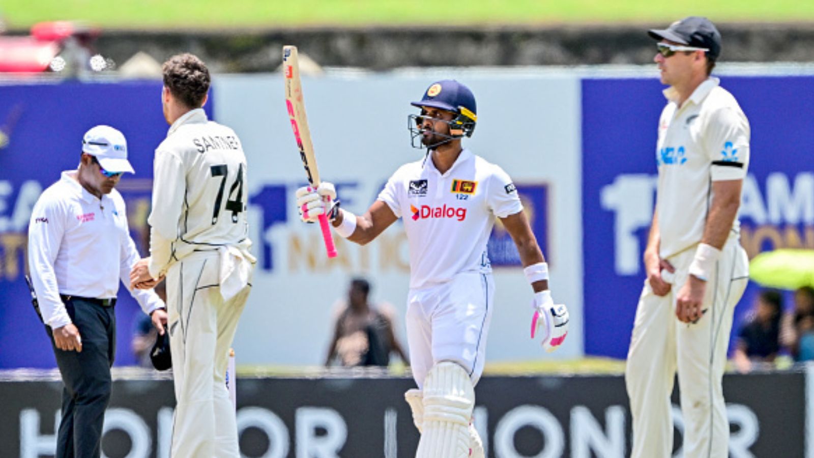 SL vs NZ, 2nd Test: Dinesh Chandimal's century helps Sri Lanka take Day 1 honours against New Zealand, strongly placed at 306/3 Sri Lanka's Dinesh Chandimal (2R) celebrates after scoring a half-century during Day 1 of the second Test against New Zealand at the Galle International Cricket Stadium on September 26. (Getty)